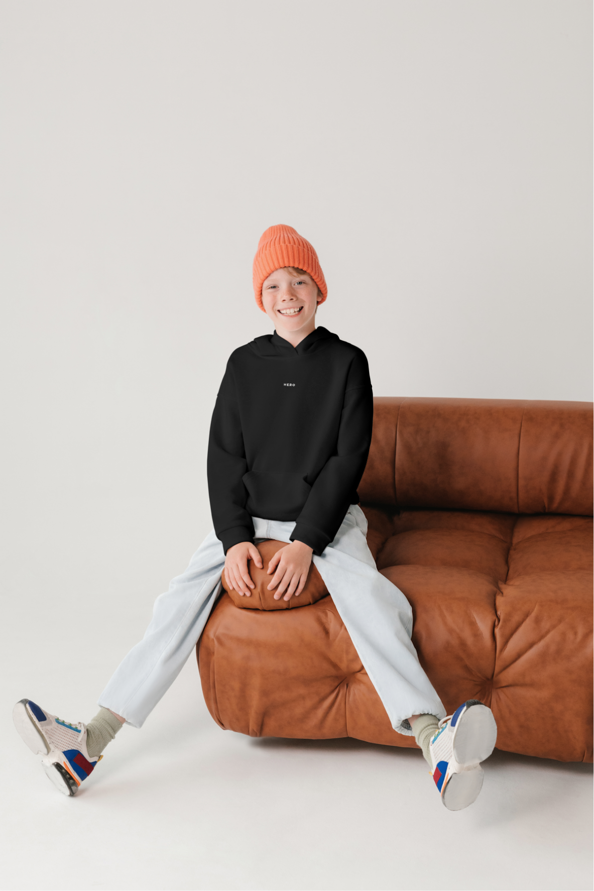 Model wearing the black HERO hoodie from the front